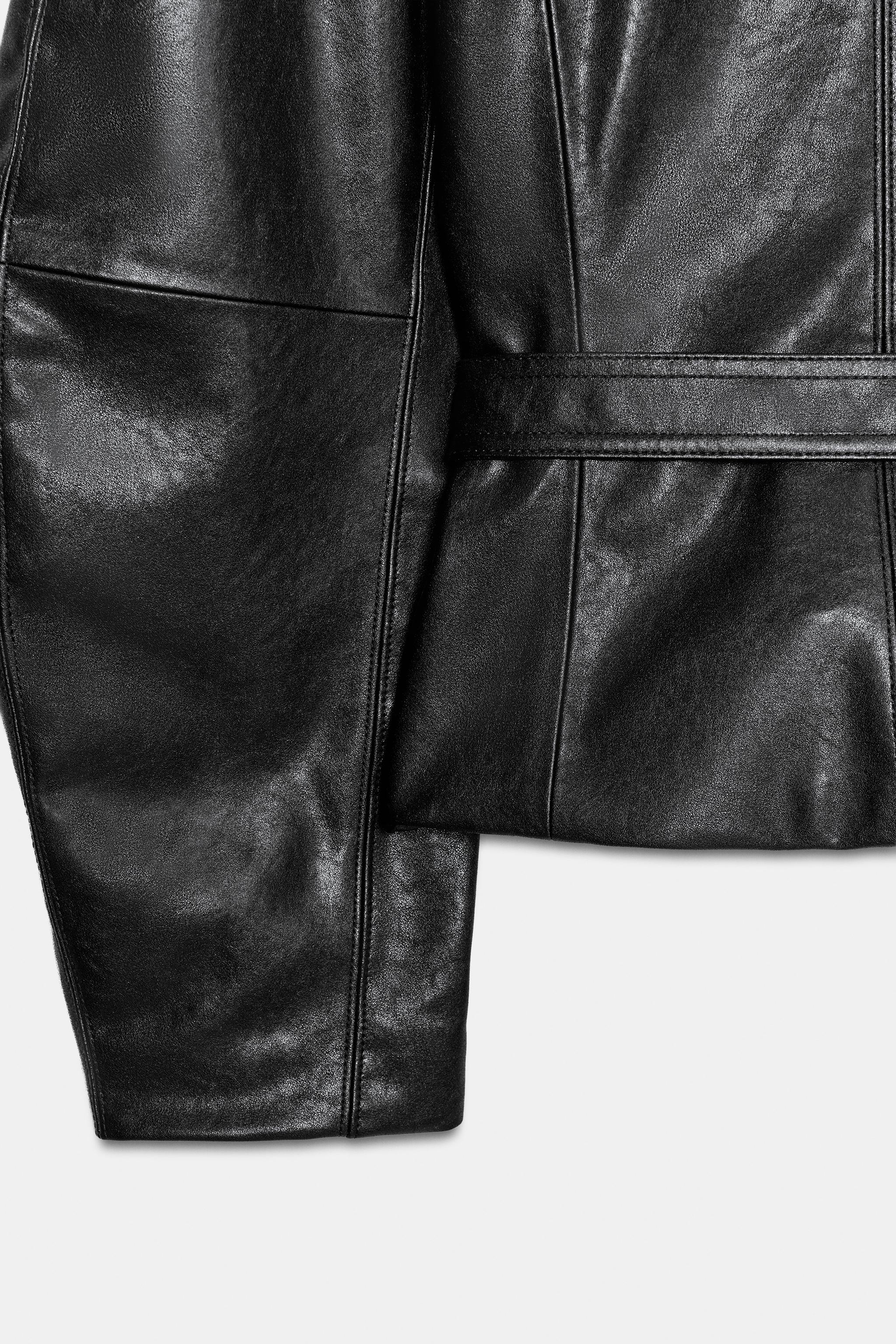 LEATHER-EFFECT BELTED JACKET